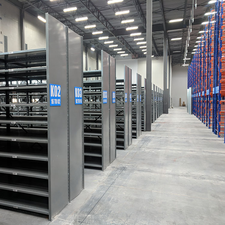 distribution center for varied sku and order picking in steel shelving for high bay