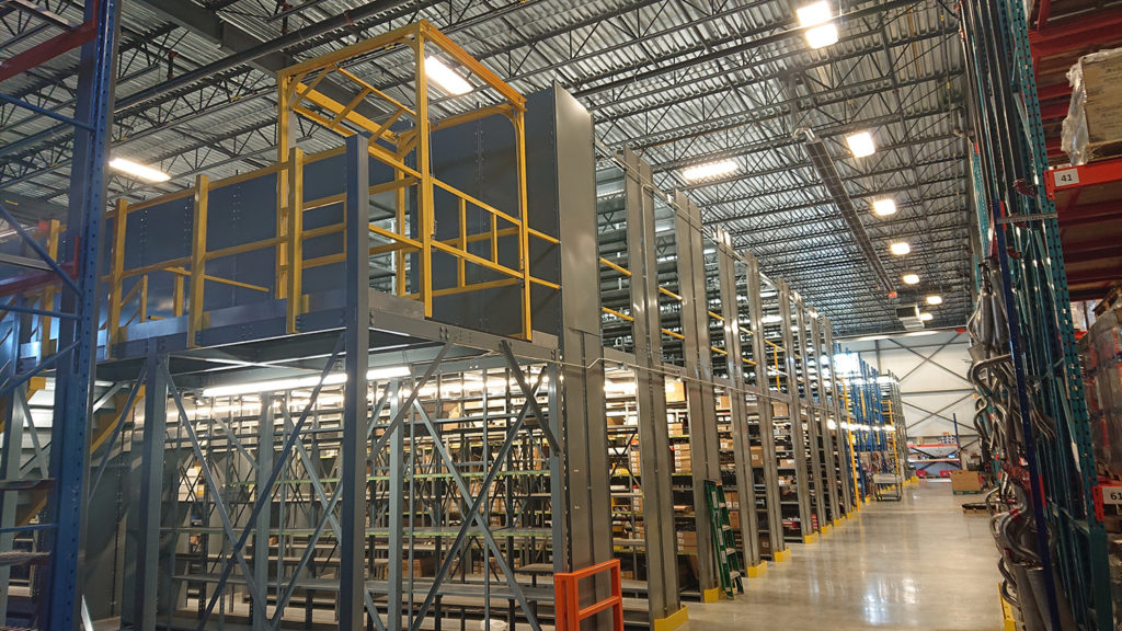 pivot gate made in house for multi level shelving system offering a safe load and unload area